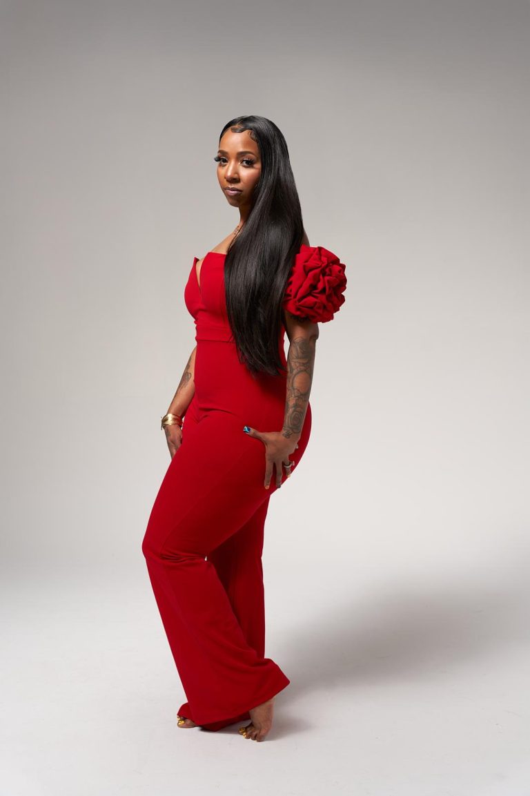 Long, straight black hair styled in a full-length portrait
