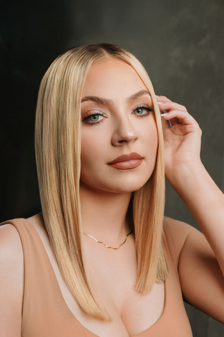 Sleek, shoulder-length blonde hair
